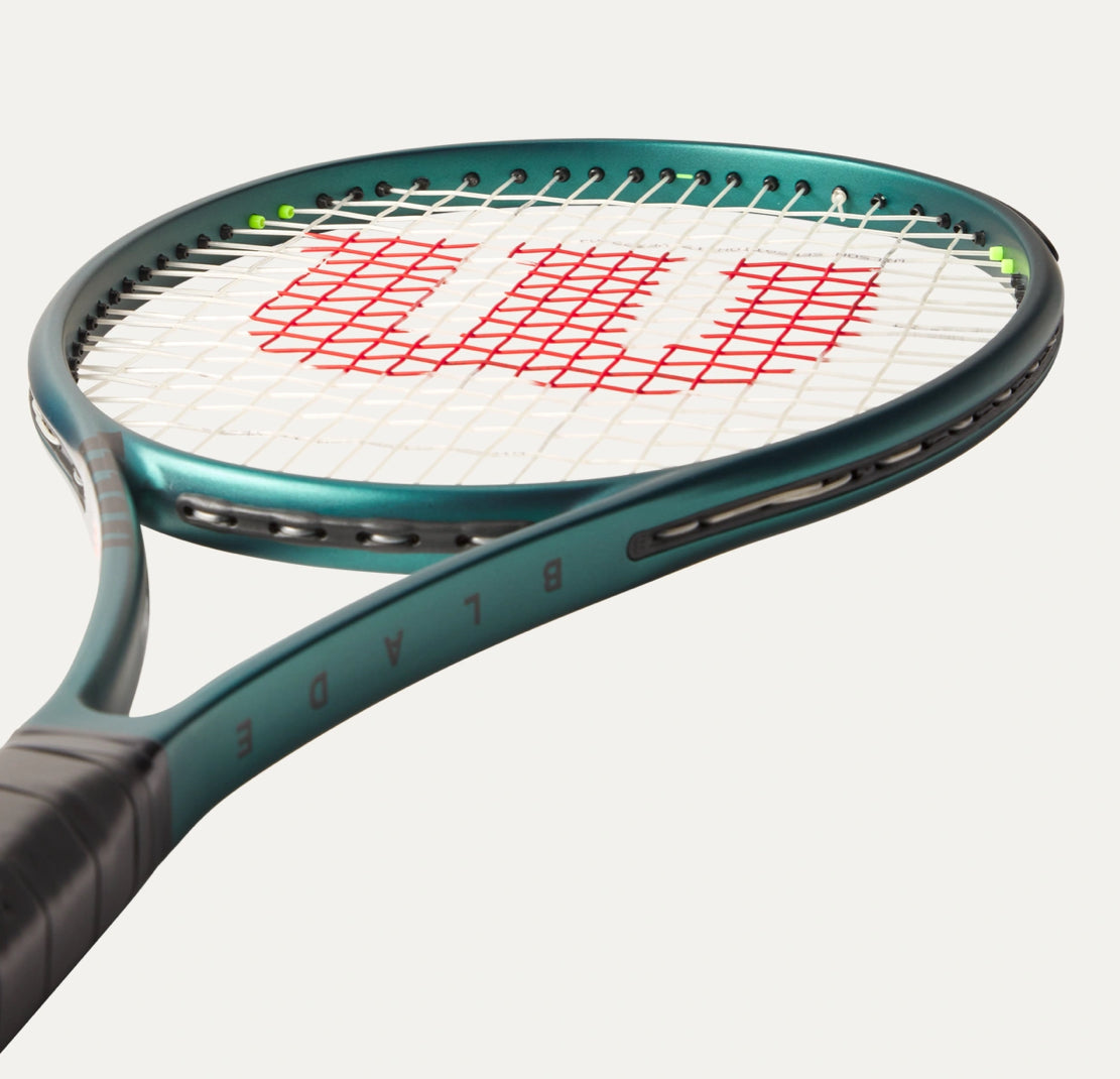 Tennis racket with Wilson logo on a white background
