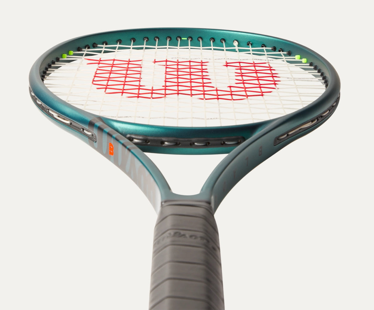 Tennis racket with Wilson logo on a white background