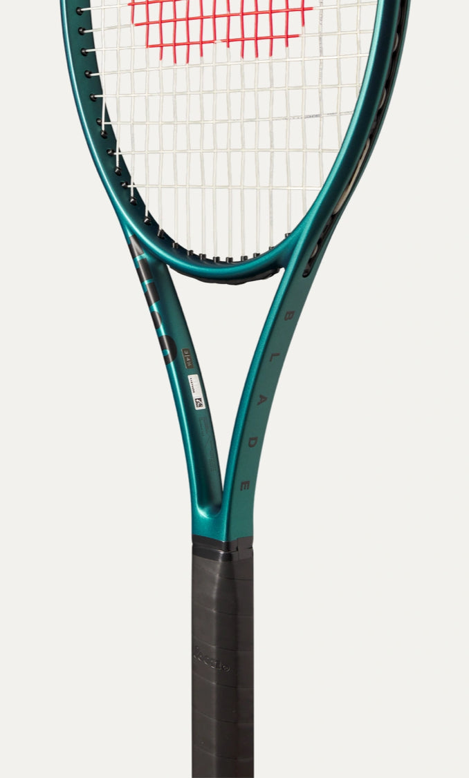 Tennis racket with a white strings background on a light gray background