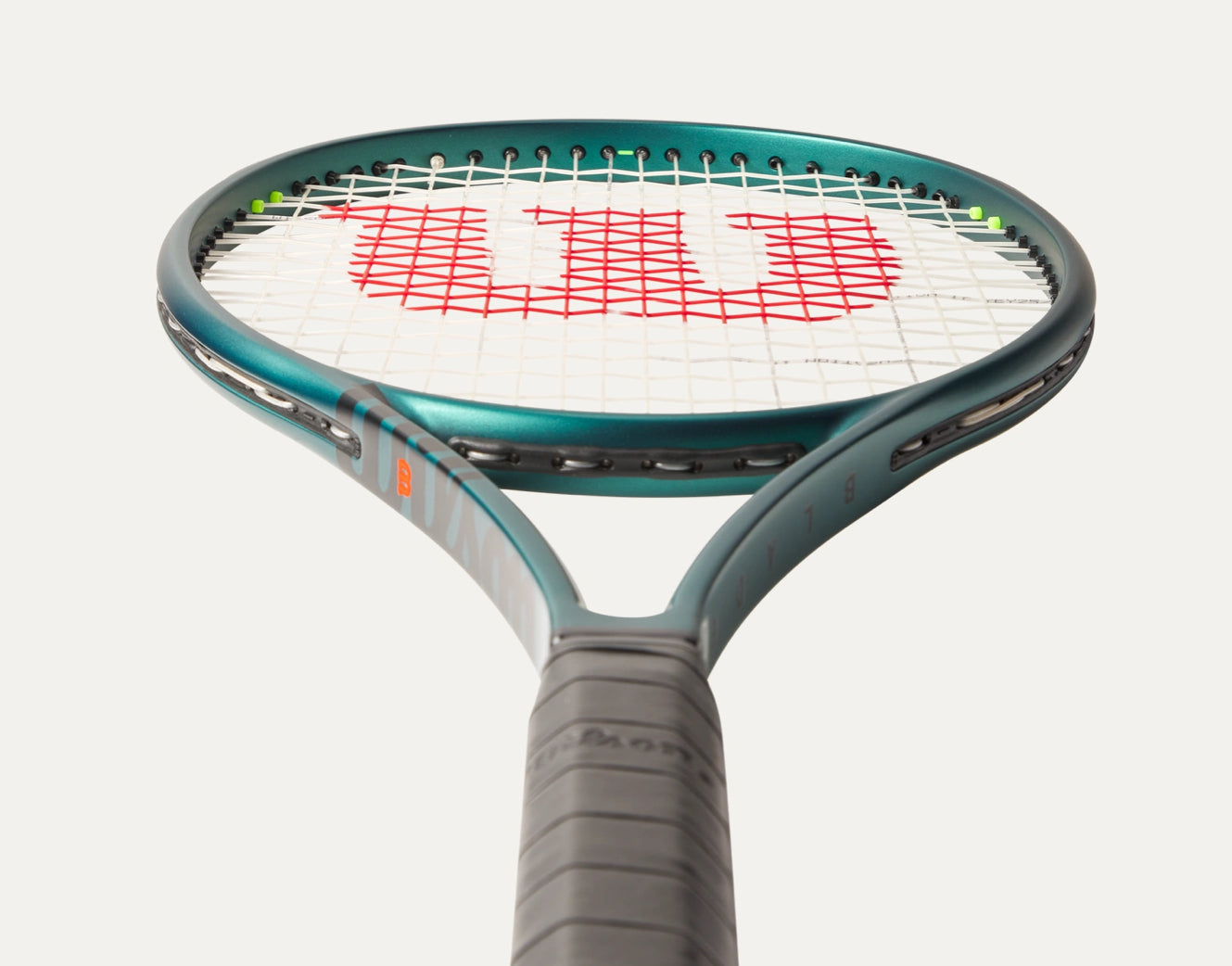 Tennis racket with Wilson logo on a white background