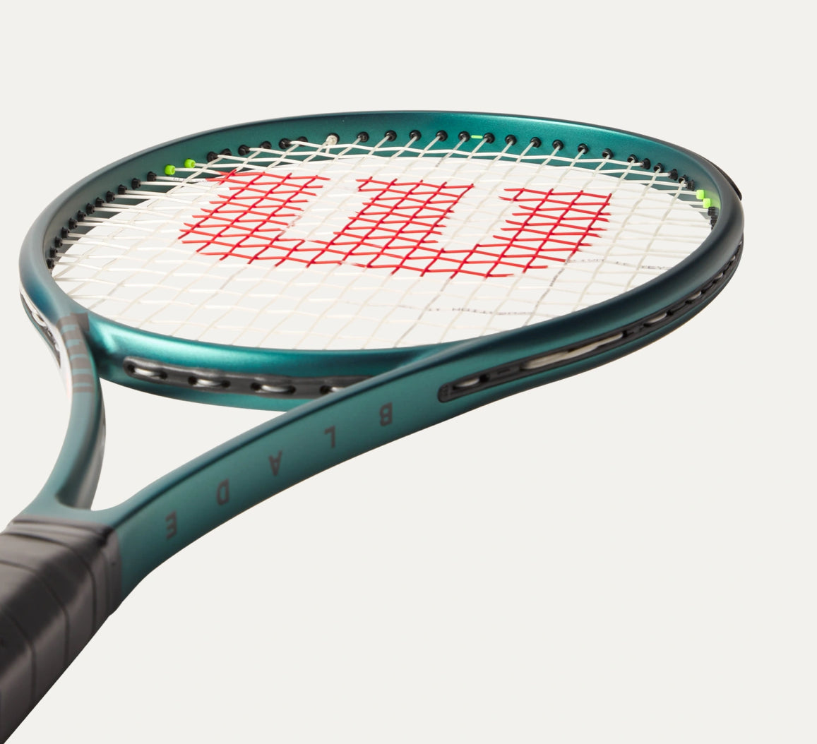 Tennis racket with Wilson logo on a white background