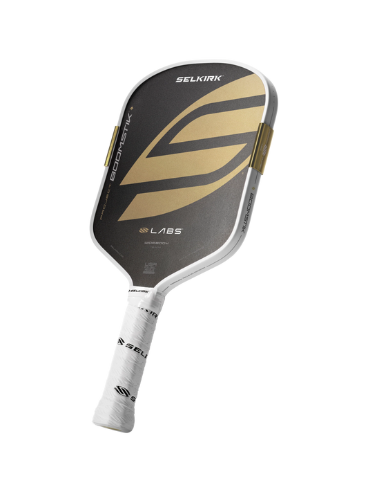 Selkirk pickleball paddle with black and gold design on a white background