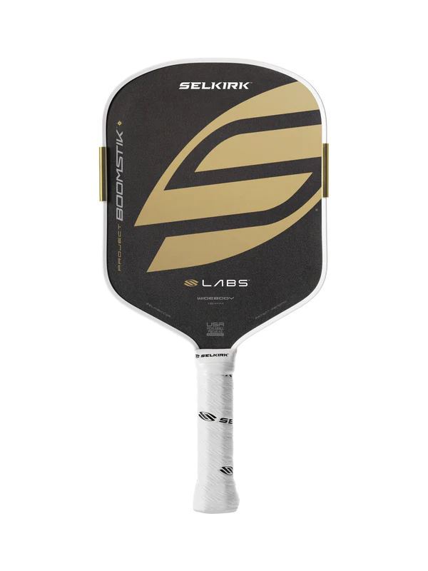 Black and gold pickleball paddle with Selkirk branding on a white background
