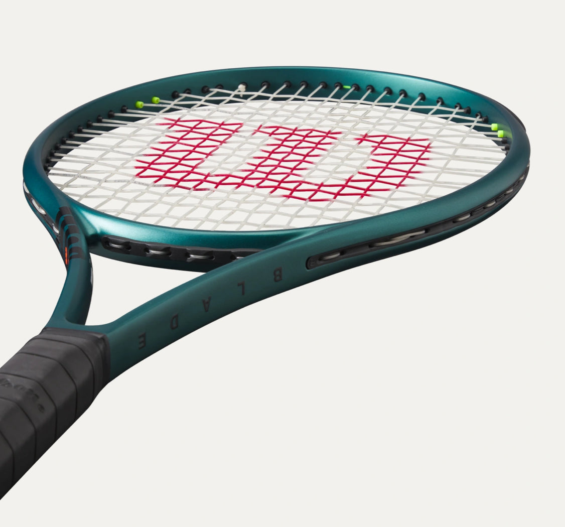 Tennis racket with Wilson logo on a white background