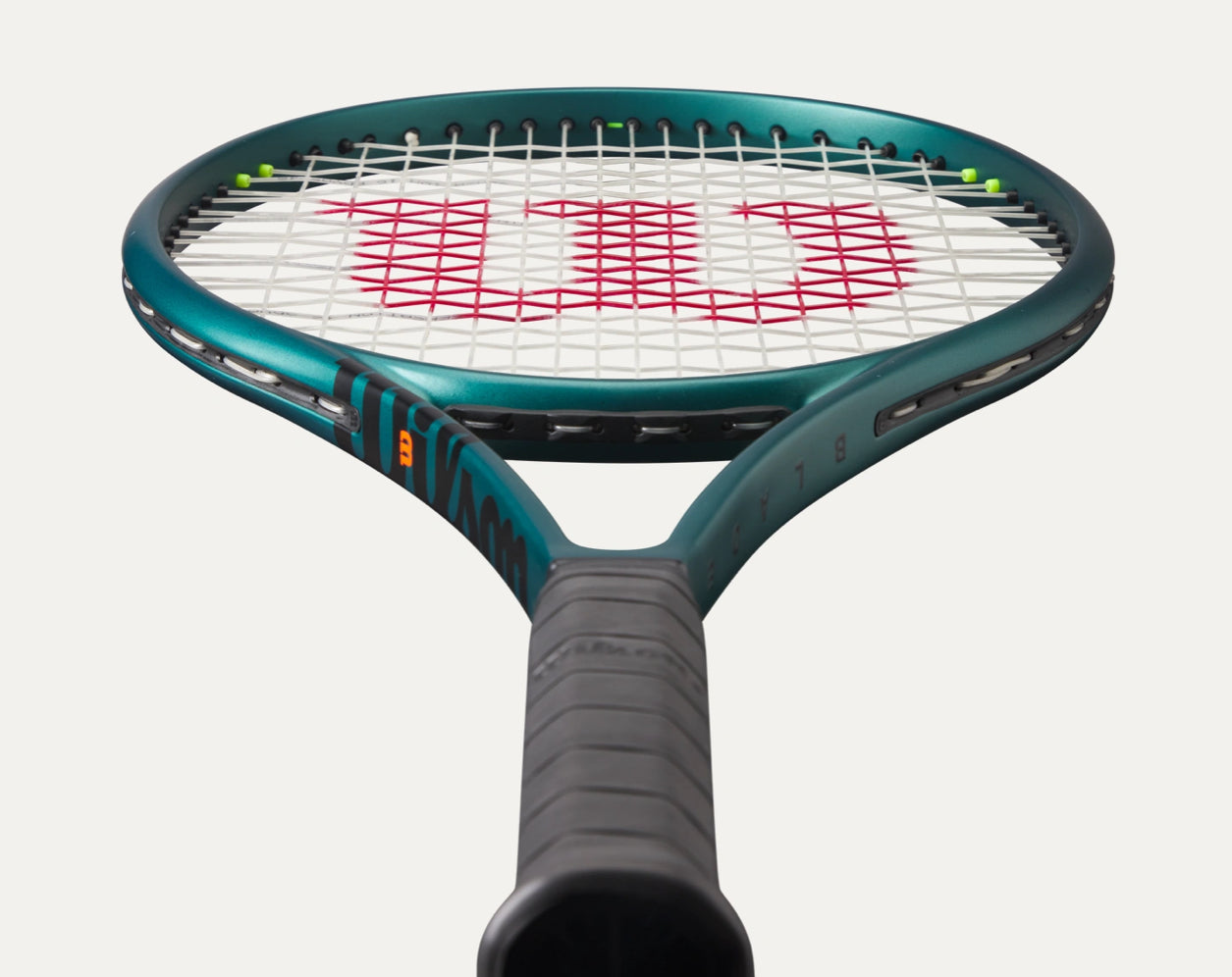 Tennis racket with Wilson logo on a white background