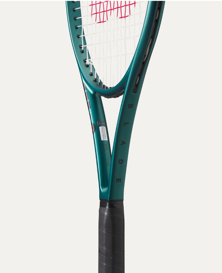 Close-up of a tennis racket with a white background