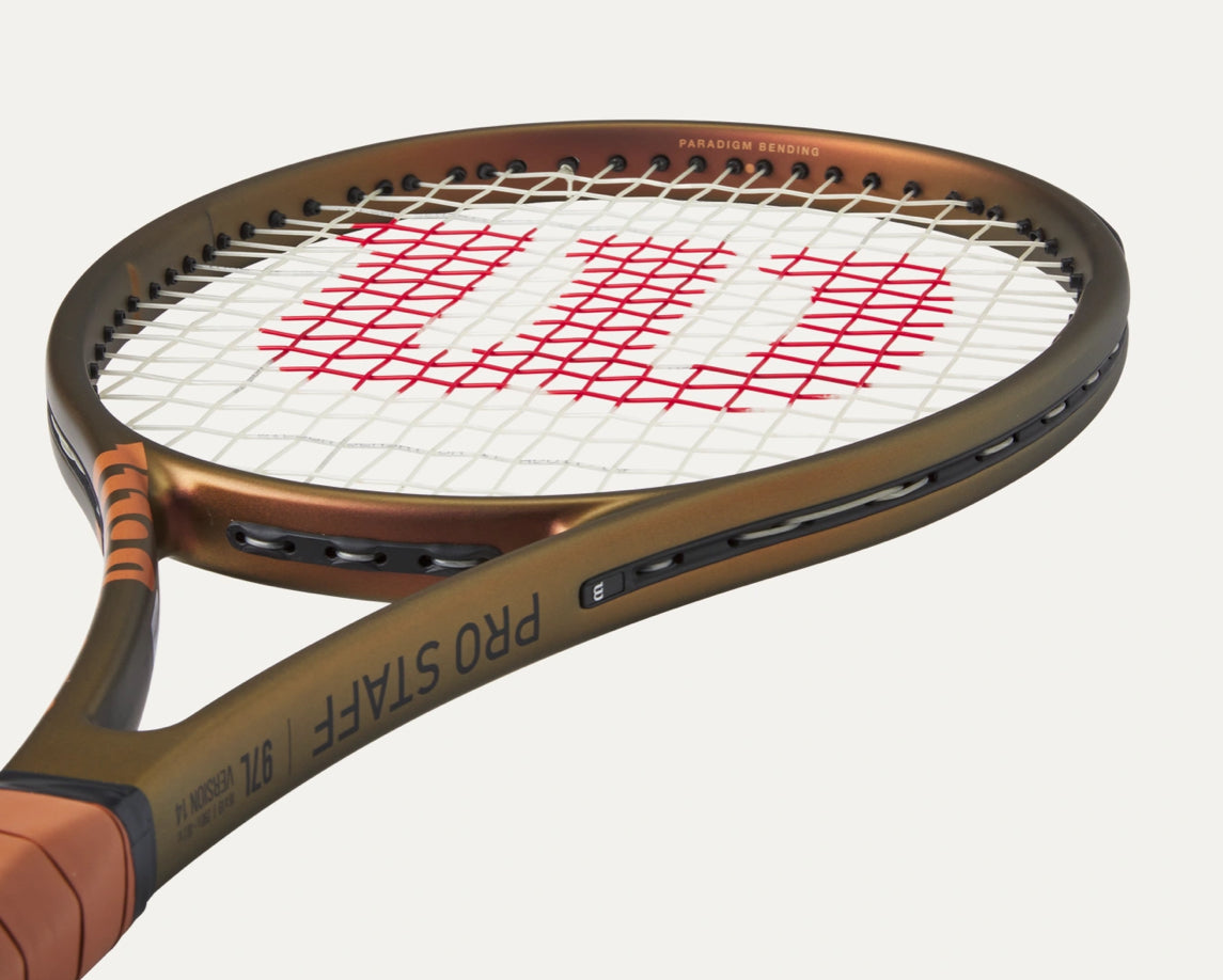 Tennis racket with Wilson logo on a white background