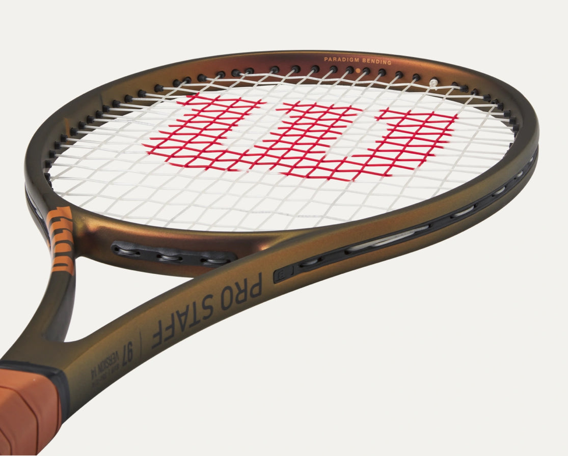 Tennis racket with Wilson logo on a white background