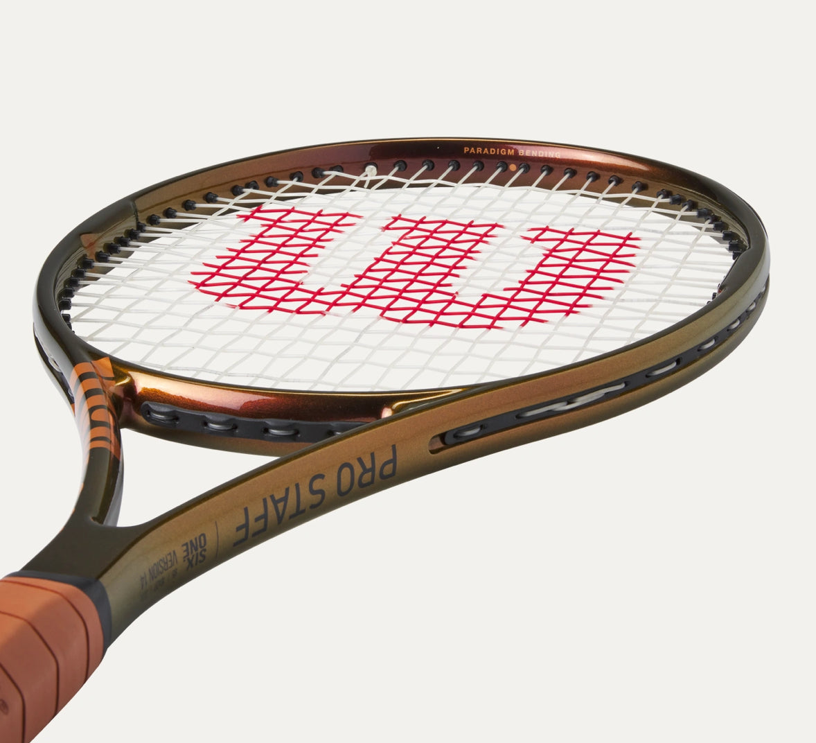 Tennis racket with Wilson logo on a white background
