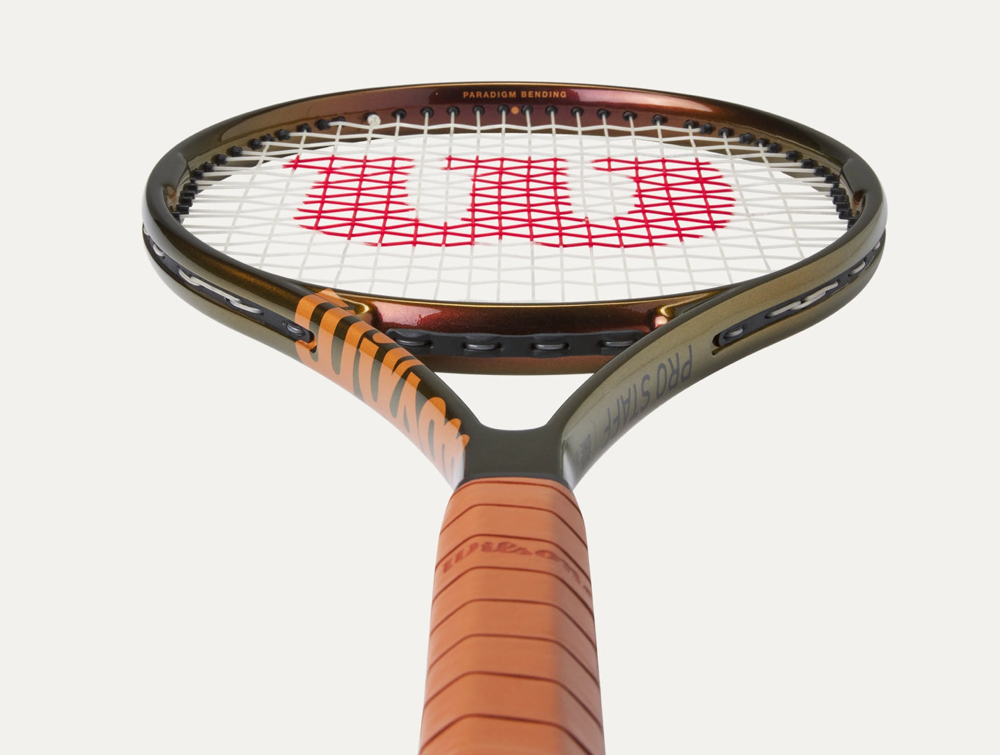 Tennis racket with Wilson logo on a white background
