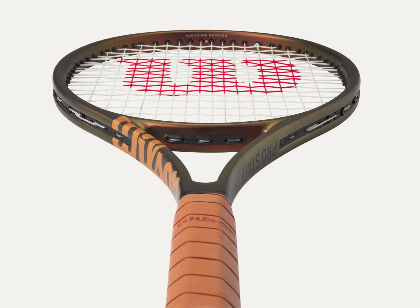 Tennis racket with a brown handle and black frame on a white background