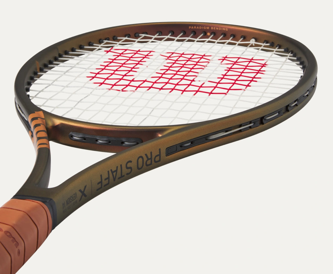 Tennis racket with a close-up of the Wilson logo on a white background