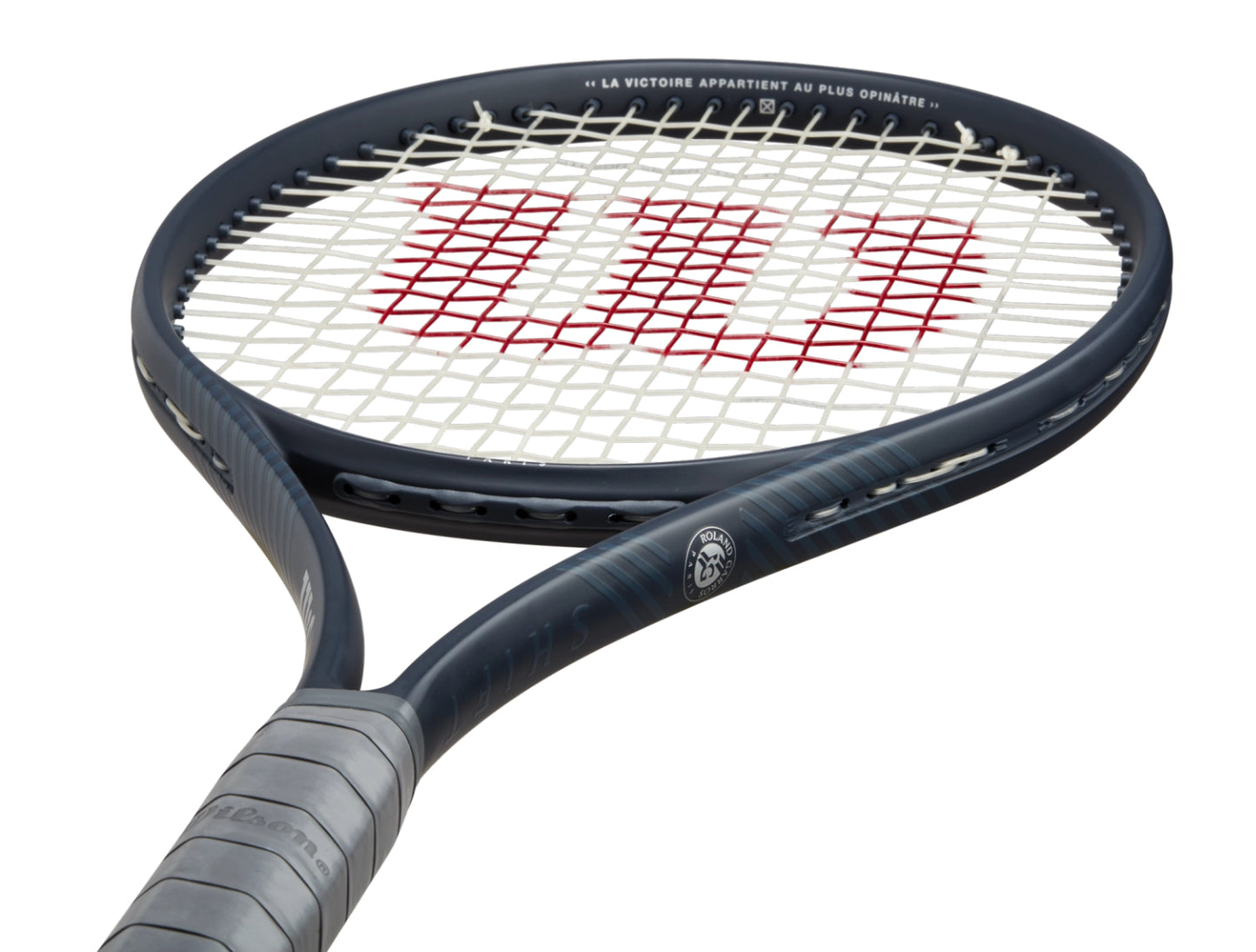 Tennis racket with Wilson logo on a white background