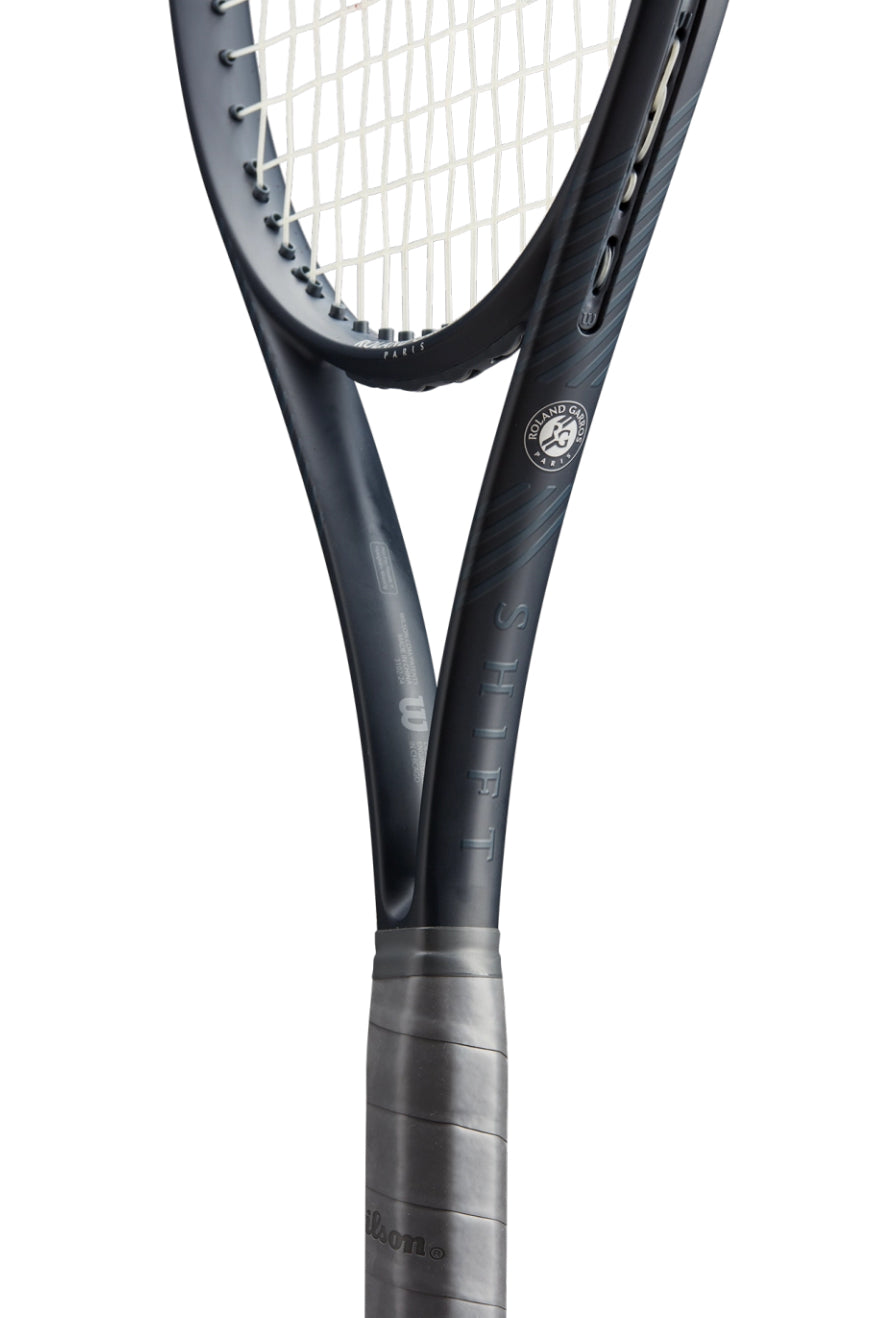 Close-up of a tennis racket with a white background