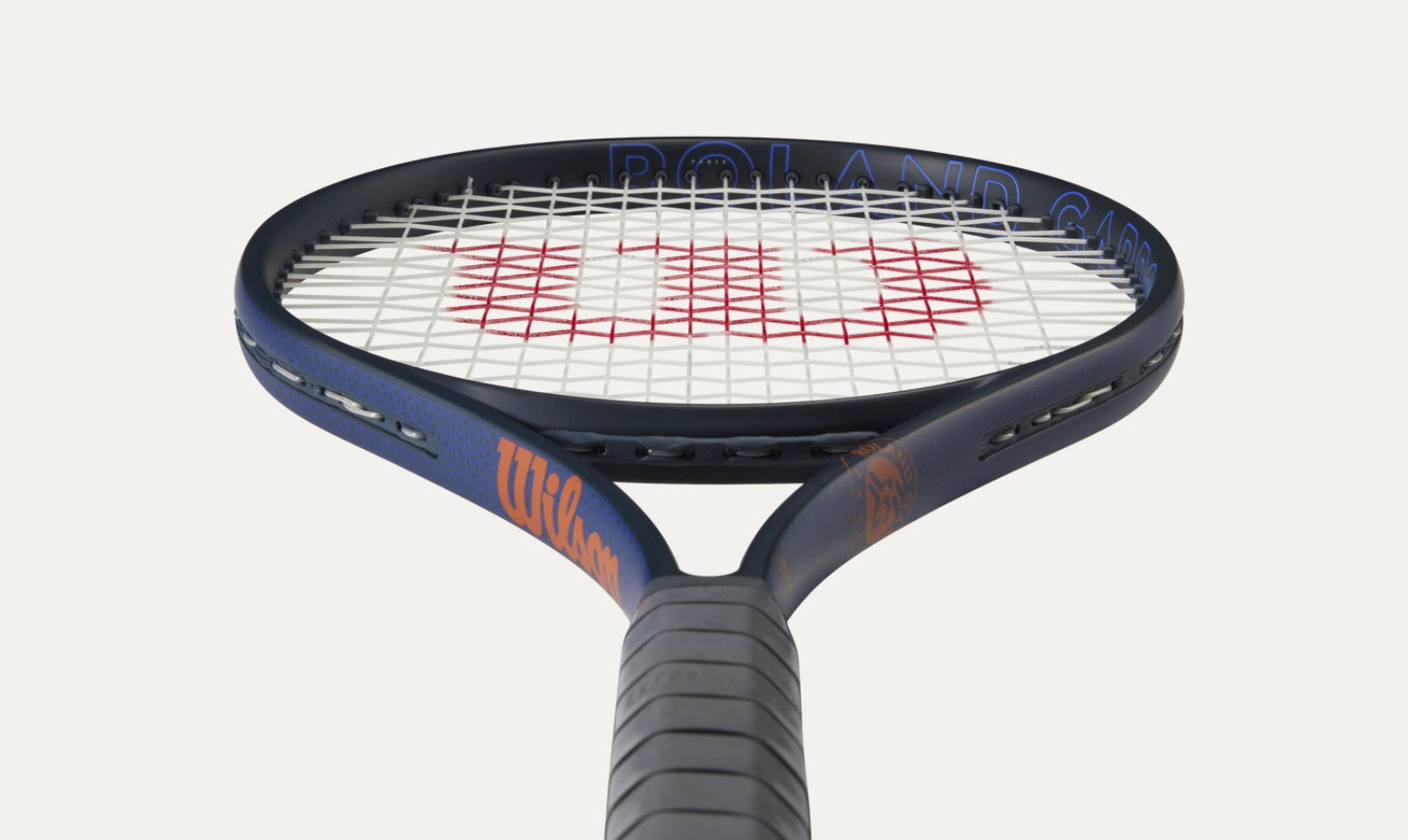 Tennis racket with Wilson branding on a white background