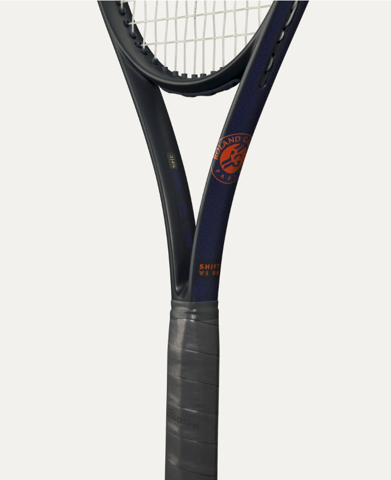 Close-up of a tennis racket with a brand logo on a white background