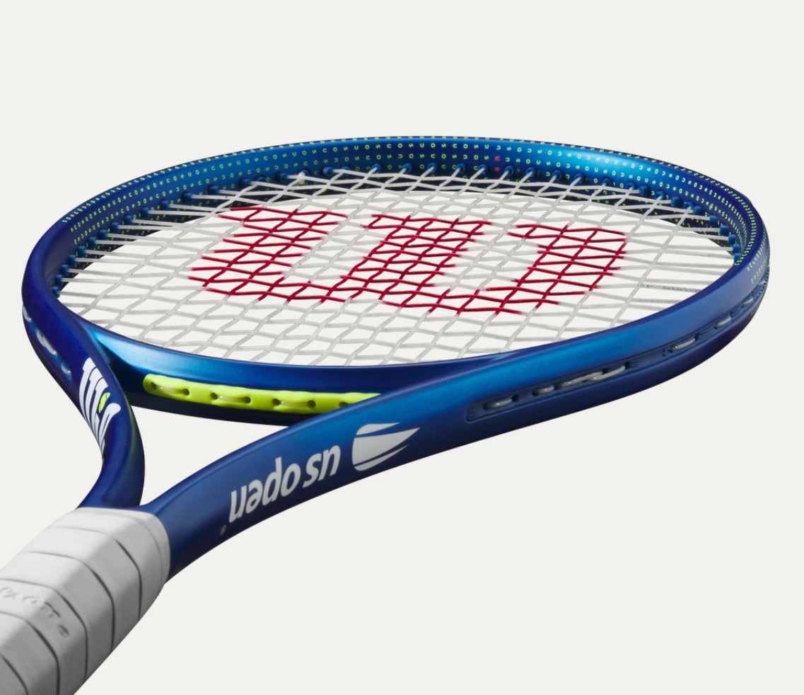 Tennis racket with Wilson logo on a white background