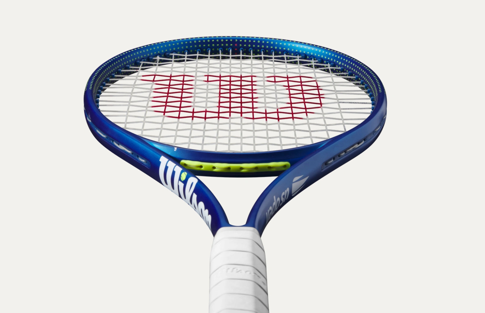 Tennis racket with Wilson branding on a white background